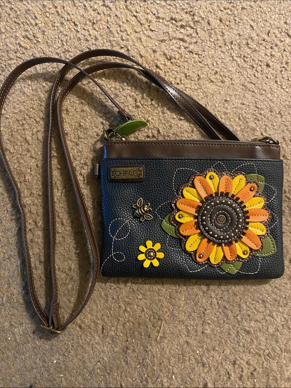 Chala Black Crossbody with Brown Trim and Yellow-Orange Sunflower Applique